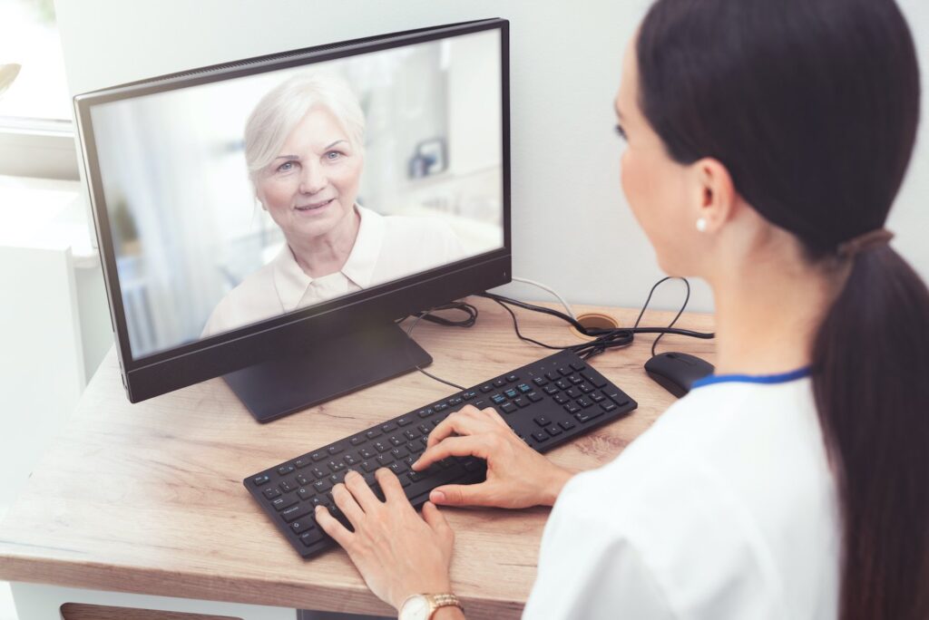Elderly patient engaging in telehealth consultation