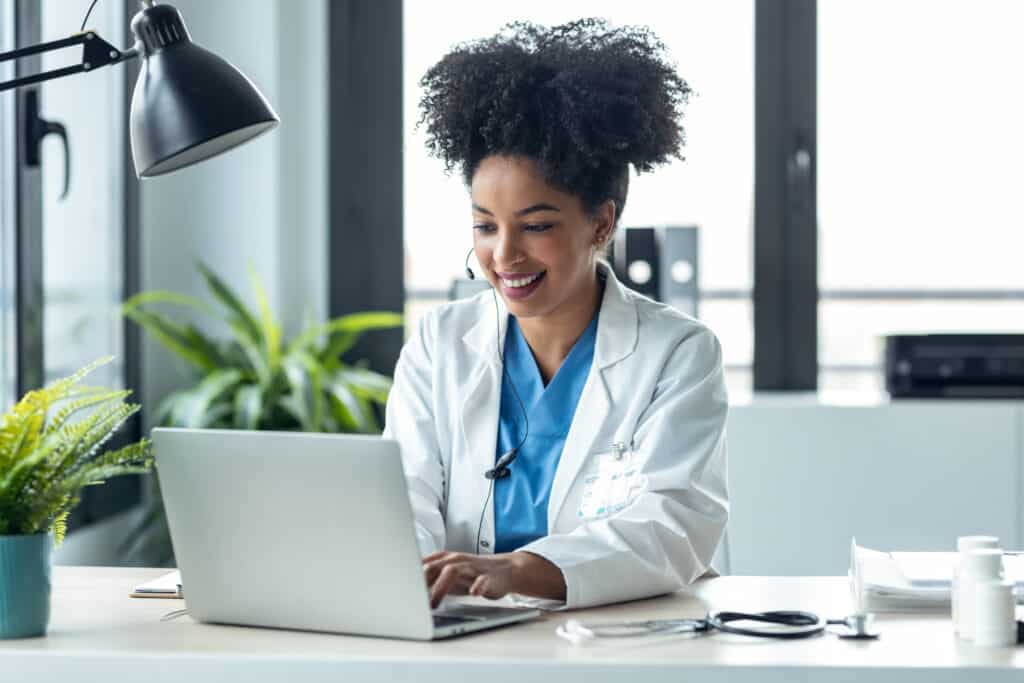How AI Document Analysis Improves Efficiency Shot of attractive afro female doctor talking while explaining medical treatment to patient through a video call with laptop in the consultation.