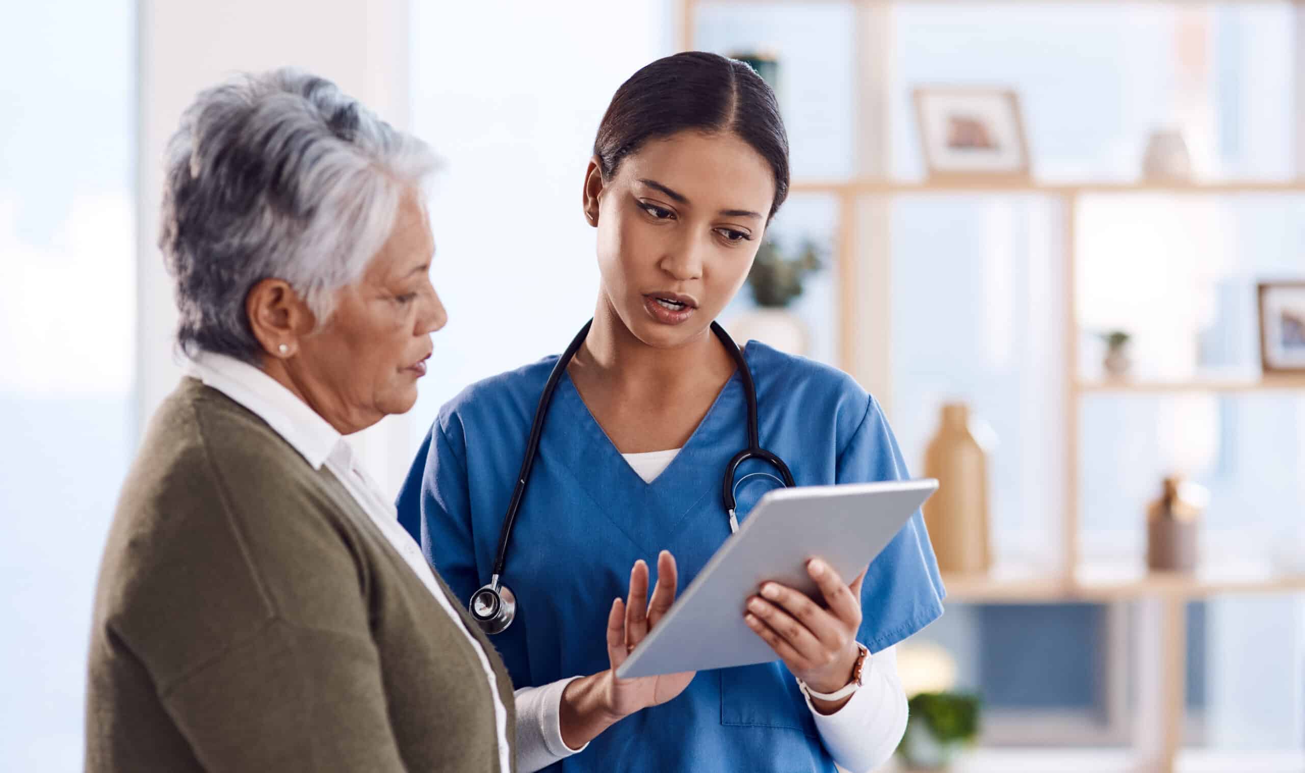 Telehealth, senior woman or doctor with digital tablet, consultation or planning treatment for cure. Female person, employee or medical professional with a patient, women or technology for healthcare.