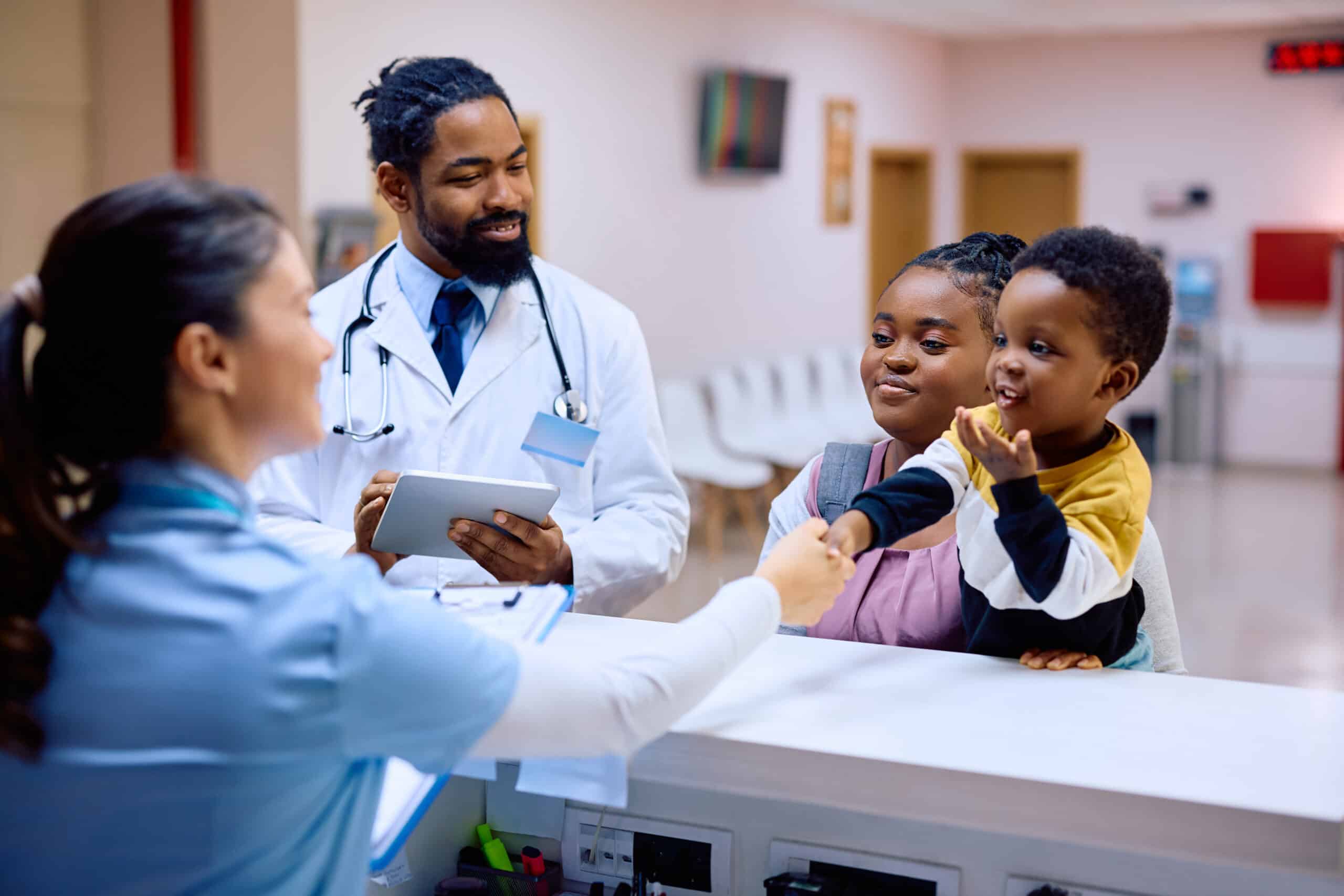 doctor and patient discussing care in primary care office setting