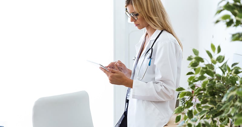 Healthcare professional reviewing patient confidentiality guidelines