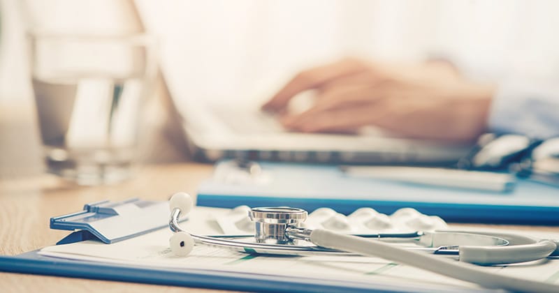 Clinic staff sending medical records via fax