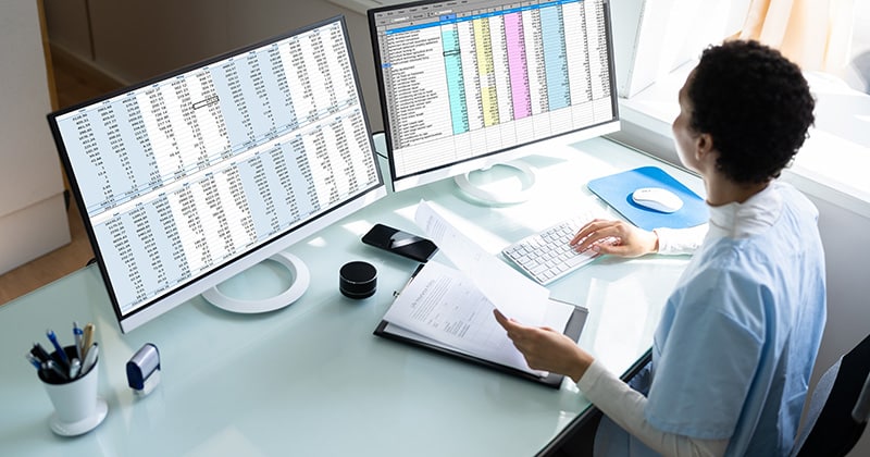 Coding specialist reviewing patient medical records