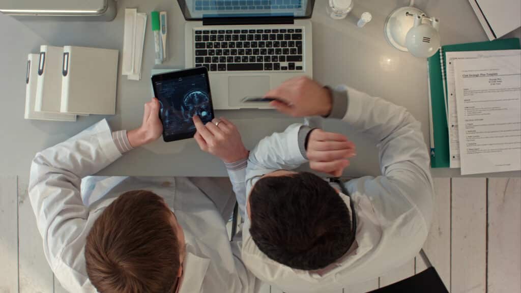 Doctor using a tablet for digital patient records.