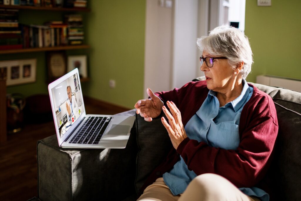 Elderly patient having a video consultation with a healthcare provider
